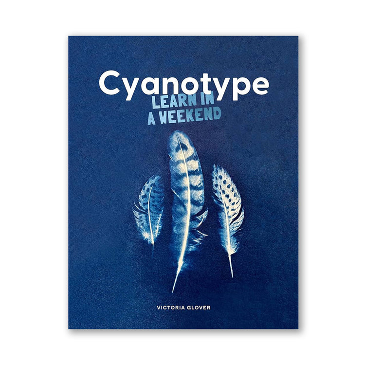 A cover image of the book titled 'Cyanotype: Learn in a Weekend' by Victoria Glover, featuring a blue background with white text and feather illustrations.
