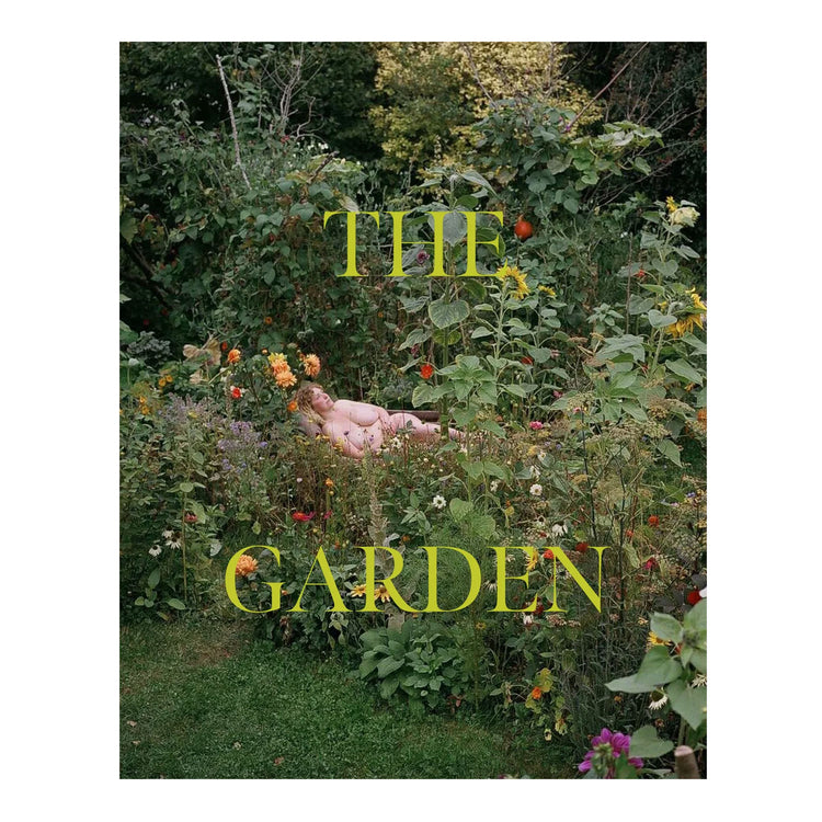 A book cover featuring a photograph of a person lying in a lush garden with various flowers, and the title 'THE GARDEN' displayed prominently at the bottom.