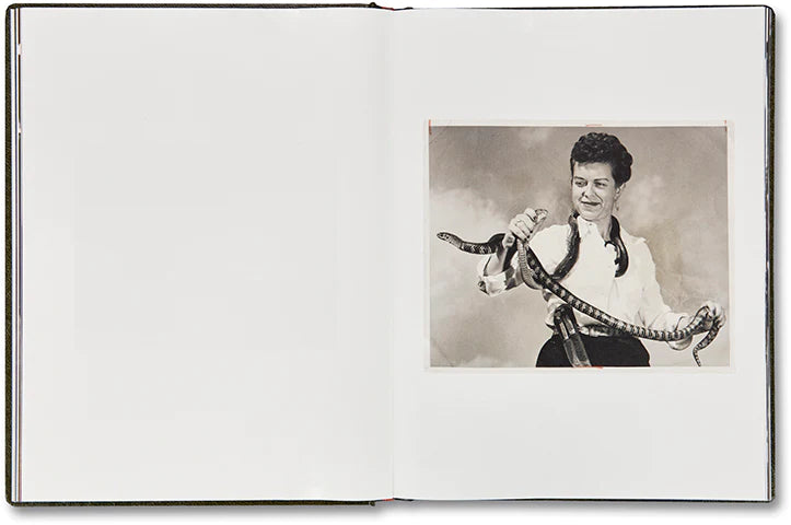 Girl Plays with Snake by Clare Strand