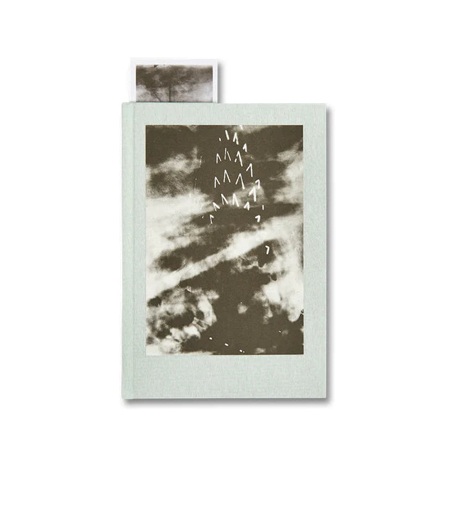 Book with a cover featuring abstract design on a white background