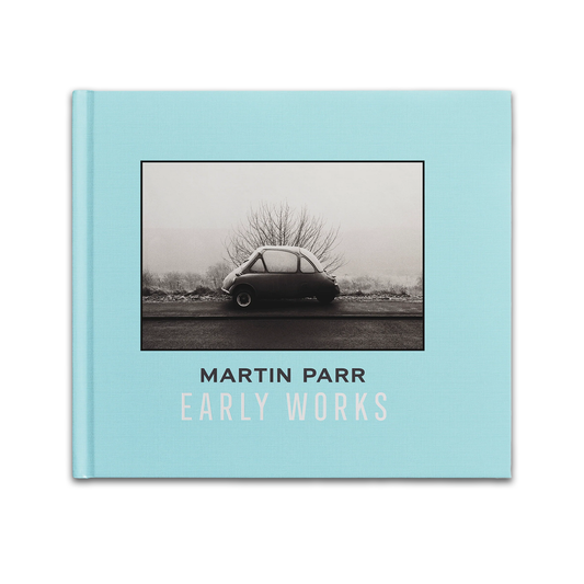 Book cover of 'Early Works' by Martin Parr with a black and white photo of a car on a light blue background