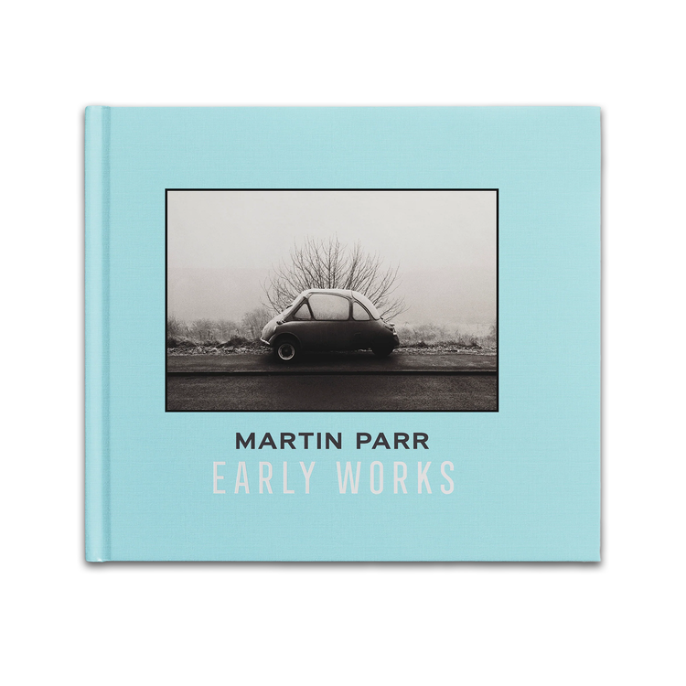 Book cover of 'Early Works' by Martin Parr with a black and white photo of a car on a light blue background